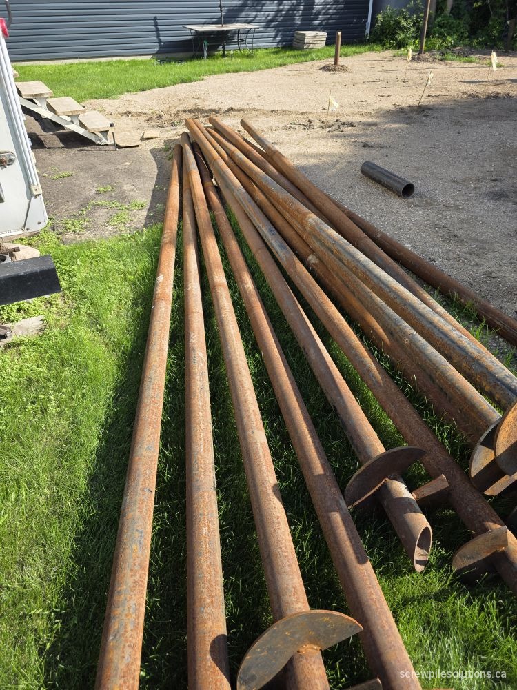 Substandard screw piles laid out on site